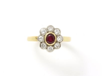 null Ring in gold 750 thousandths, decorated with a faceted oval ruby in closed setting...