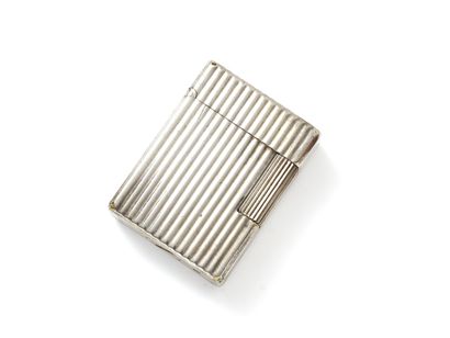 null DUPONT Gas lighter in silver plated metal, with grooved decoration. Signed and...