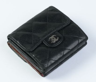 CHANEL: Black quilted leather wallet with...
