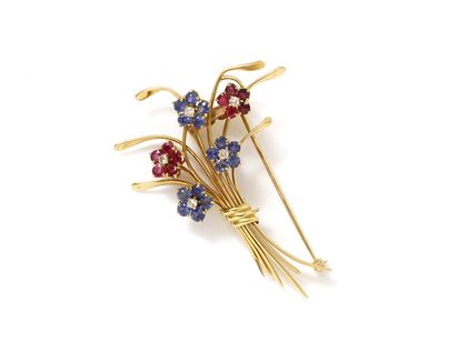 null Brooch clip stylizing a flower bouquet, the petals adorned with rubies and round...