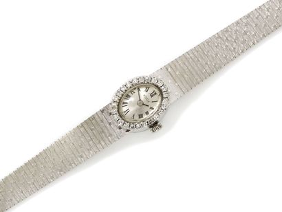 null Montre bracelet de dame en or gris 750 millièmes, de forme ovale, cadran argenté...
