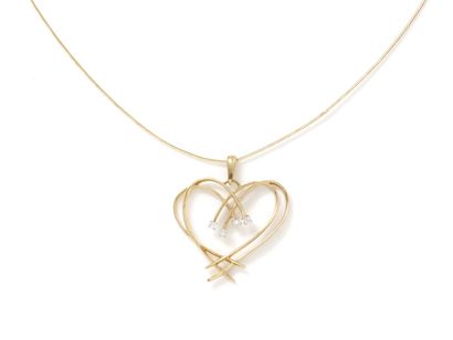 null Pendant in gold 750 thousandths, stylizing a heart openwork punctuated with...