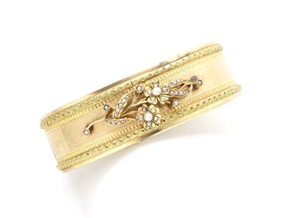 null Bracelet opening hinged rush 2 tones of gold 750 thousandths, applied to a floral...