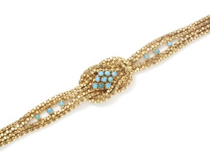 null Flexible gold bracelet 750 thousandths, decorated with flat knot, the mesh composed...