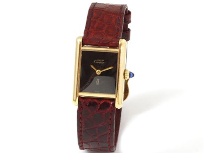 null CARTIER ''TANK'' PM

Lady's wristwatch in gold 750 thousandths, black dial....
