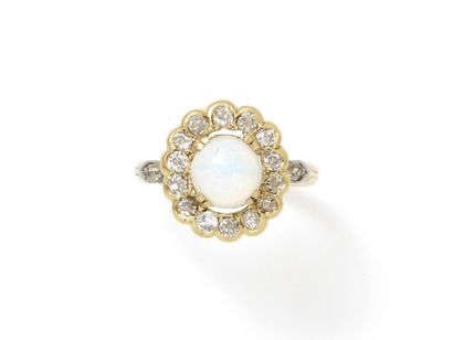 null Gold ring 750 thousandth, decorated with an opal cabochon in claw setting surrounded...