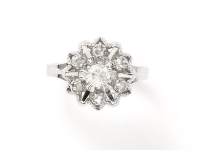 null Ring in white gold 750 thousandth, stylizing a snowflake, decorated with a brilliant...