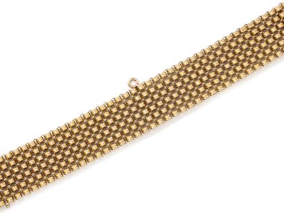 null Ribbon bracelet in gold 750 thousandth, the mesh decorated with braces and small...