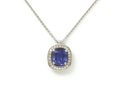 null Necklace in white gold 750 thousandths, holding in pendant a cushion-cut sapphire...
