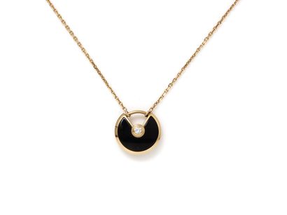 null CARTIER ''AMULET XS''

Necklace in pink gold 750 thousandths, holding a circular...