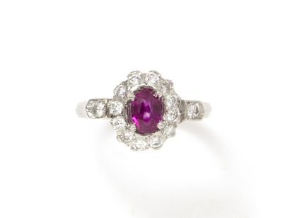 null Ring in white gold 750 thousandths decorated with a faceted oval ruby of beautiful...