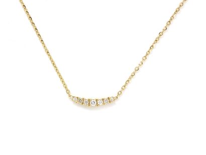 null Necklace in gold 750 thousandths, centered of a slightly curved motive heightened...