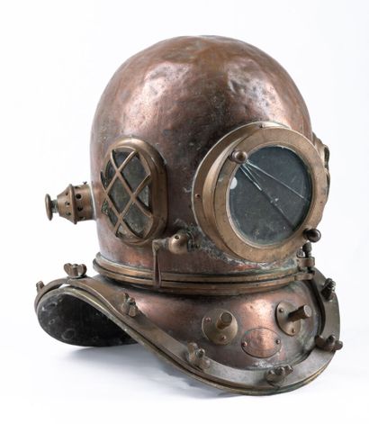 A diver's helmet in red copper with a 