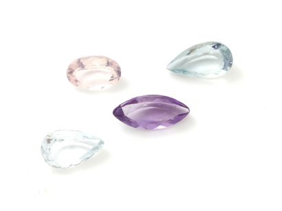 null Lot composed of 4 stones on paper: 1 amethyst shuttle size, 2 topaz pear size,...