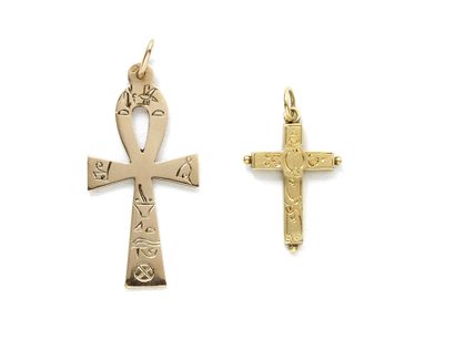 null Lot in gold 750 thousandths, consisting of two pendants holding a Latin cross...