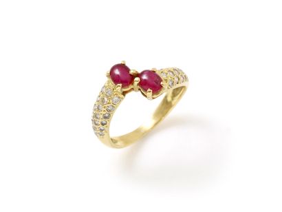 null Ring you and me in gold 750 thousandths, decorated with 2 cabochons of rubies...