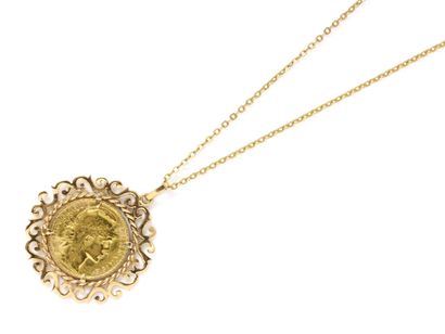 null Pendant carries coin in gold 750 thousandths, holding a coin of 20 francs gold...