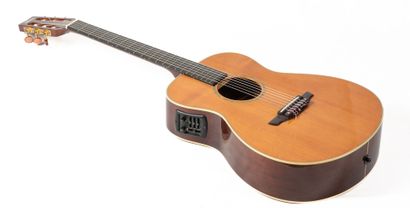 null A YAMAHA FPX 300N classical guitar, sold with its case and guitar holder, and...