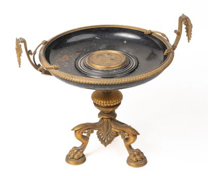 null A bronze and metal pedestal bowl, lion feet and central medal, D 31 cm, H 32...