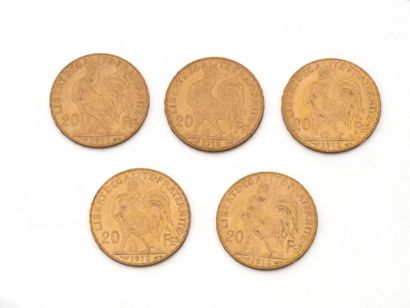 null Lot in 750 thousandths gold, consisting of:
1 French 20-franc coin dated 1911,...