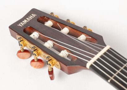 null A YAMAHA FPX 300N classical guitar, sold with its case and guitar holder, and...