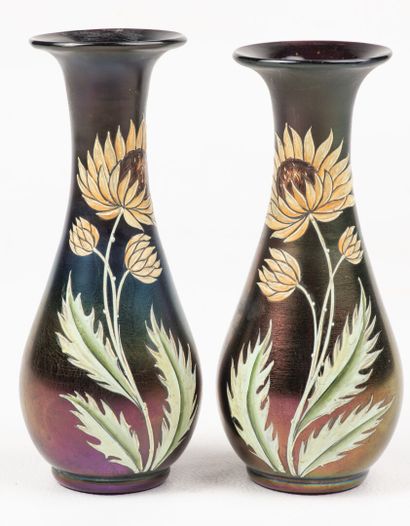 null A pair of small iridescent vases marked under the base in the taste of "Loetz"...
