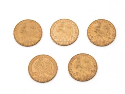 null Lot en or 750 millièmes, composé de:
3 pièces de 20 francs français datées 1904,...