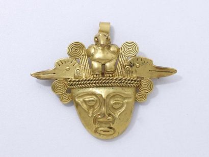 null Broche pendentif en métal doré représentant un masque Chaman-L'homme oiseau....