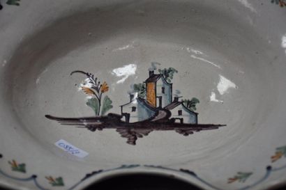 null 18th century French faience beard dish decorated with thatched cottages. Width...
