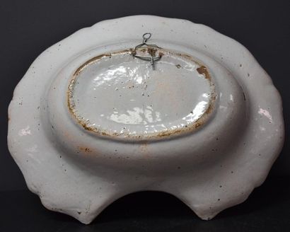 null 18th century French faience beard dish decorated with thatched cottages. Width...