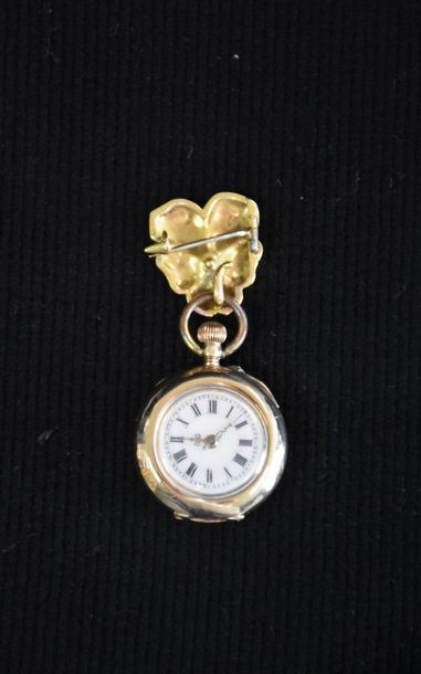 null Watch and its 14 k gold flower and enamel brooch.