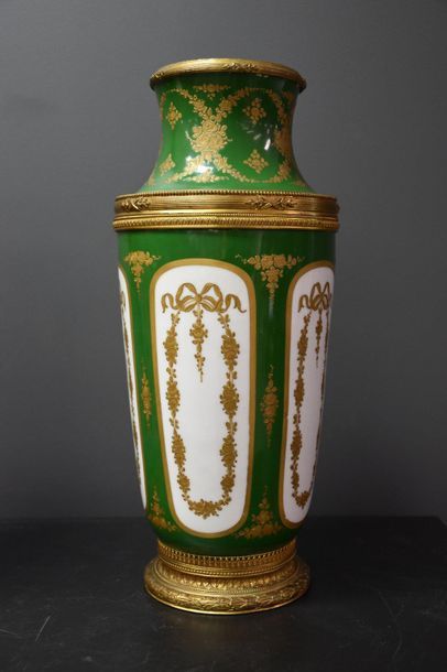 null Pair of Sèvres porcelain vases, green and gold tones decorated with flowers...