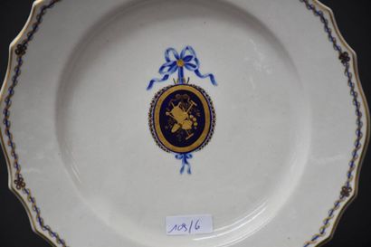 null Plate in Tournai porcelain decorated with gardening attributes in a blue and...