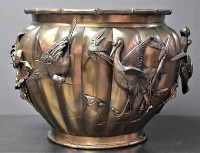 null Japanese bronze flowerpot decorated with relief animals. Ht 30 cm.