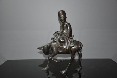 Asian bronze sculpture monk on a buffalo....