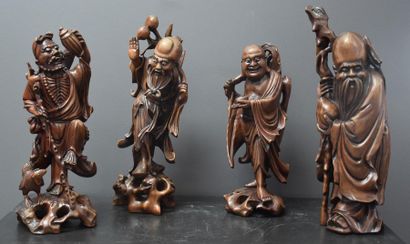 Series of 4 Chinese carved wooden immortals...