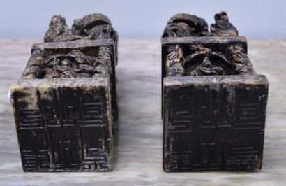 null Pair of Chinese hard stone seals decorated with fô dogs with carved base of...