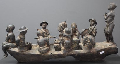 null Important bronze du Benin, barque chargée de personnages africains et de missionnaires...