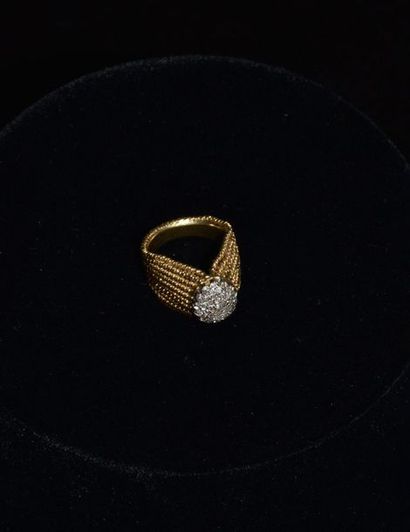 null Ring in 18 k gold forming a drapery and set with small diamonds . Weight 11,2...