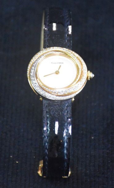 null Cartier watch model Trinity sold with box and original documents.