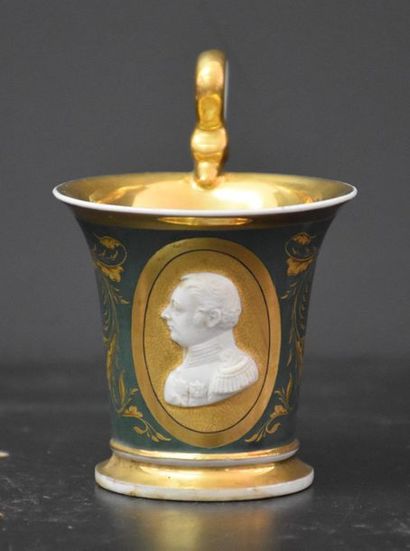 null Green and gold porcelain cup and saucer with relief portrait decoration. Mark...