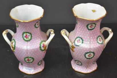 null Pair of Sèvres porcelain vases on a pink background decorated with floral reserves....
