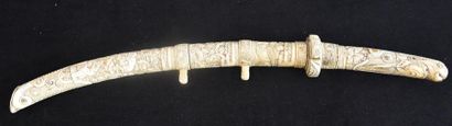 null Carved ivory katana decorated with mother-of-pearl cabochons. Japan 19th century...