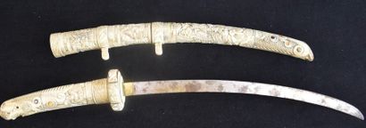 null Carved ivory katana decorated with mother-of-pearl cabochons. Japan 19th century...