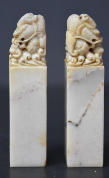 null Pair of Chinese hard stone seals with carved dragon decorations . Ht 8 cm .