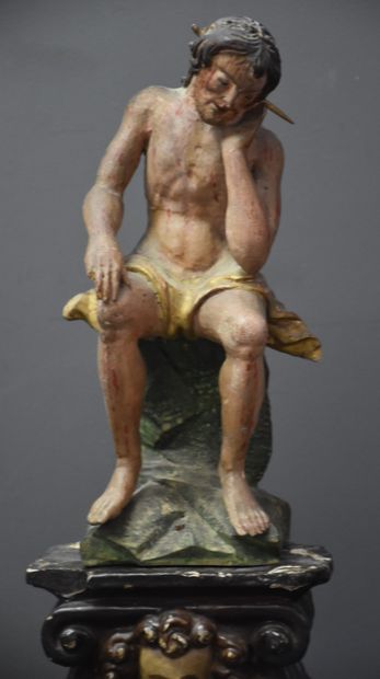 null Christ sitting at the crown of thorns. Carved polychrome wood. It is set on...