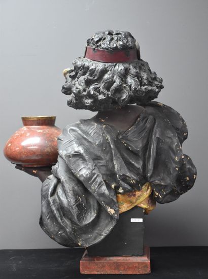 null Schreiner. The Egyptian. Terracotta bust representing an oriental bearer holding...