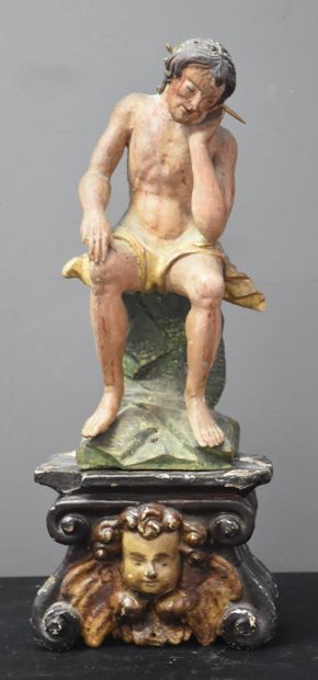null Christ sitting at the crown of thorns. Carved polychrome wood. It is set on...