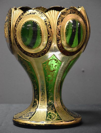 null Chalice-shaped vase made of engraved golden crystal. 

Slight scratches on the...