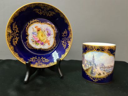 null Chocolate cup and its saucer in Meissen porcelain on a blue and gold background...